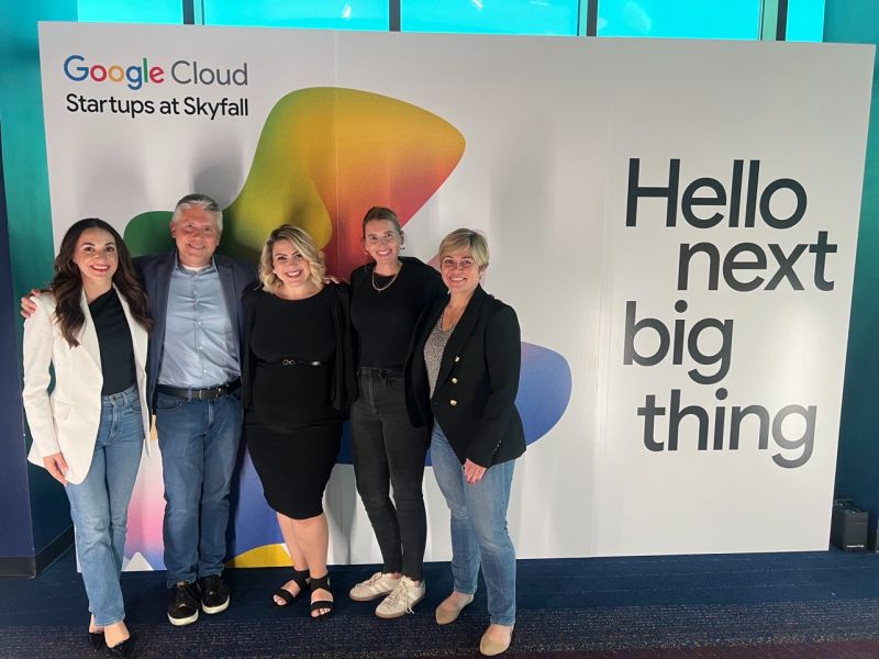 Smiling in front of the backdrop